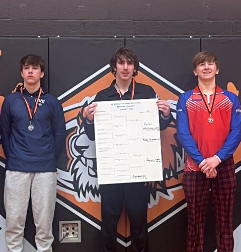 Taking first place at 138 pounds was Callen Whitney (center). Whitney won all three of his matches including two by pin fall.