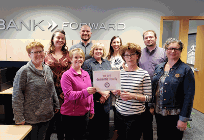Pictured are (from left) Ronda Hopen, Jessica Johnson, Tara Standfield, Mark Sylstad, Jeanne Kelley, Heidi Thole, Cherrie Bargman, Brent Asell and Suzanne Smith.