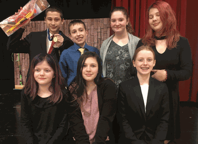 Storyteller Wyatt Lahr (back left) took first place in Storytelling and Thalia Meyer (bottom right) took third in Extemporaneous Reading. Also competing were (front row from left) Isla McDougle in Creative Expression, Madi Rzab in Humor, (back) Hunter Wright in Discussion, Izabel Padgett in Poetry and Caydence Rzab in Serious Prose.