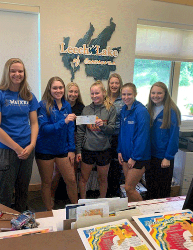 Pictured with their check are (from left) Megan Benjamin, Brianna Raddatz, Mackenzie Raddatz, Ally Sea, Katie Sagen, Rachel Pitt and Abi Strandlie.