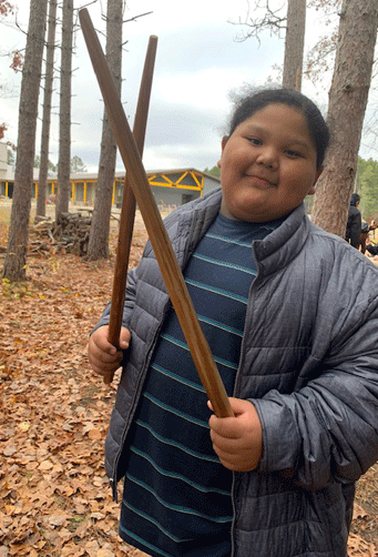 Miskwa Muckwa (Waylon Lopez-Ogema) is pictured with his finished project.