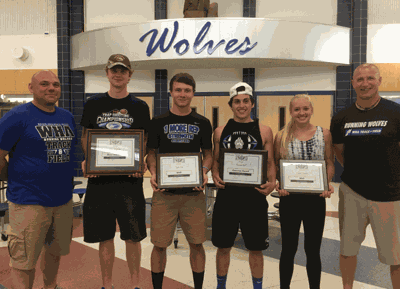 Coaches Aaron Pfeiffer (left) and Colby Marich (right) presented awards to Ben Strandlie, Tyler Sea, Kenner Bell and Taylor Nordin. Not pictured are Kira Loop and Jessica Schmidtke.