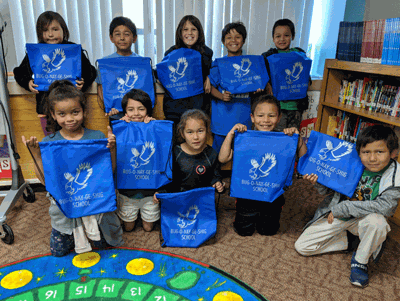 Pictured is the first-grade class with their new backpacks