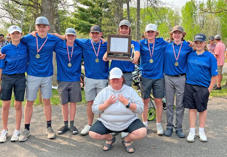 The WHA boys’ golf team  and Coach Carrie Johnson is pictured with the Northern Pines Conference championship trophy.