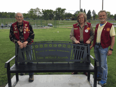 Pictured with the newly-installed bench are (from left) Treasurer Carl Berg, Secretary Sherry Kiisa and President Gary Walworth.