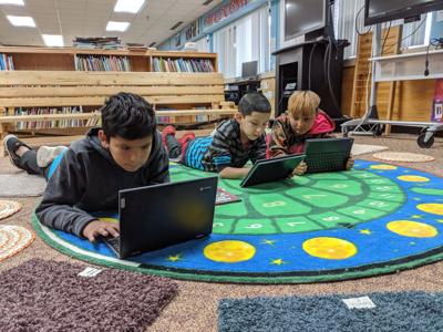 Bug-O-Nay-Ge-Shig students (from left) Darnell Drumbeater, Aavery Brown and Mark Wakanabo are trying out the new Chromebooks they recently received.