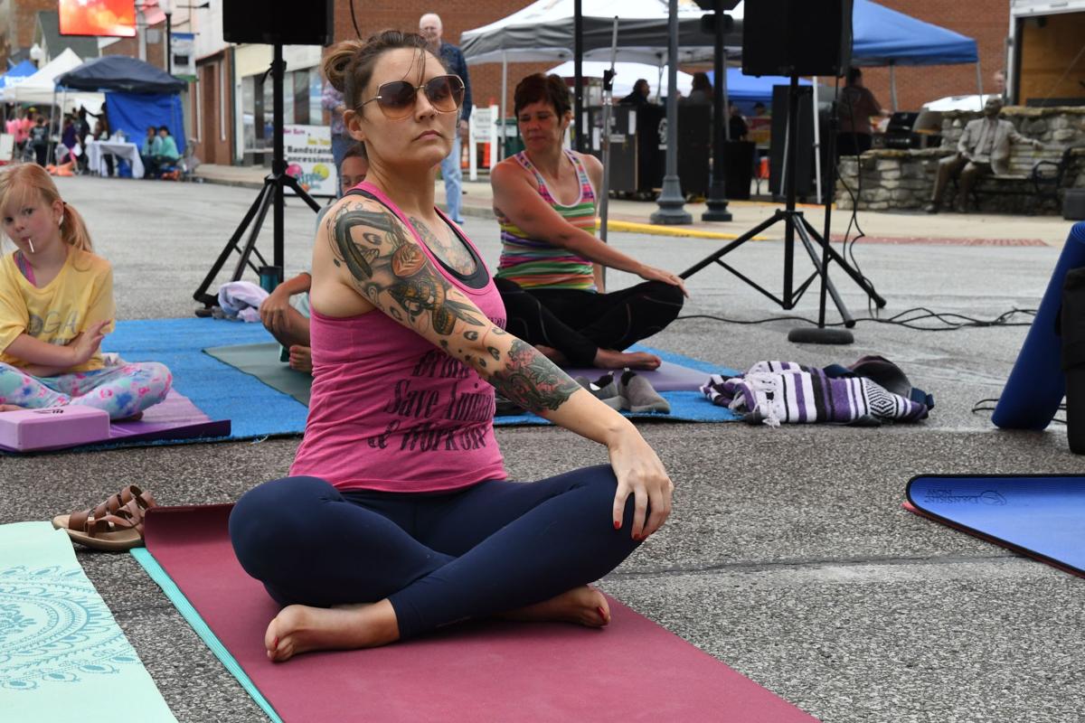 Debbie Rodimel, yoga instructor at Yoga on Maint St, leads a group yoga demonstration.JPG