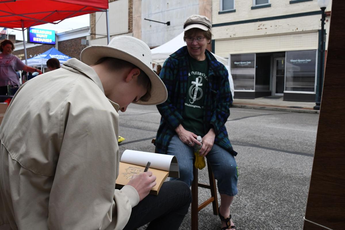 Ian Dayton works on caricature of Rev. Cherly Thorne.JPG