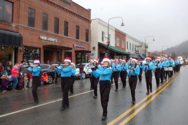 A wet winter wonderland Boone Christmas Parade takes place in damp