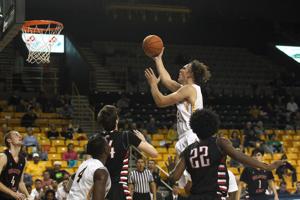 Appalachian State forward Griffin Kinney drives to the basket in the Mountaineers’ 80-60 win over Belmont Abbey on Oct. 3. (Bill Sheffield / Watauga Democrat)