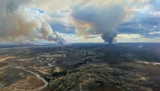 Smoke spreads in multiple directions due to shifting winds in Fort McMurray Forest Area, Alberta, on May 13, 2024