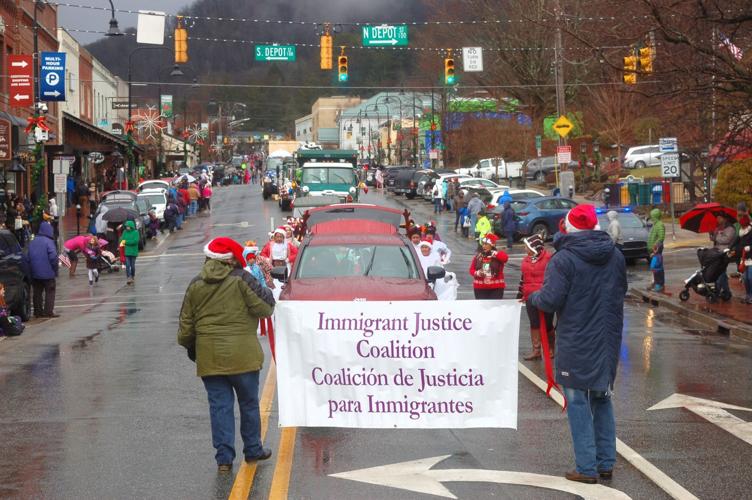 A wet winter wonderland Boone Christmas Parade takes place in damp