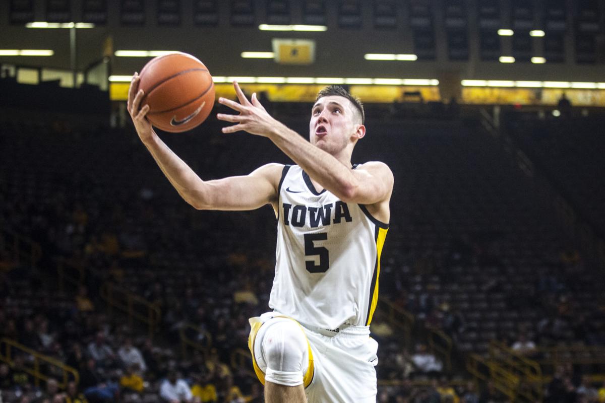 College Basketball Hawkeyes Take It To Cal Poly Basketball