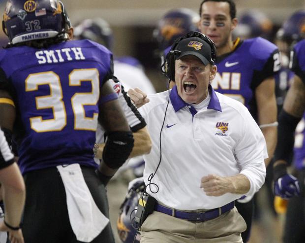 UNI head coach Mark Farley, right, celebrates a first down run by Tyvis Smith, left, during Saturday's FCS playoff game in the UNI-Dome. (Matthew Putney/WCF Courier)