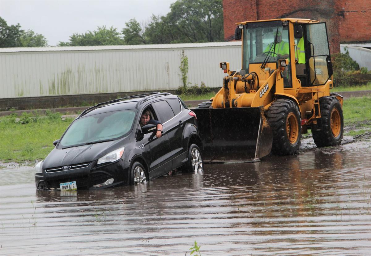UPDATE WATCH NOW Motorist stranded in flooded intersection in La