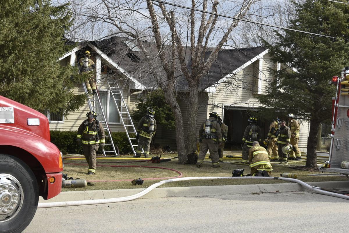 Crews from 3 fire departments handle house fire in Raymond (PHOTOS