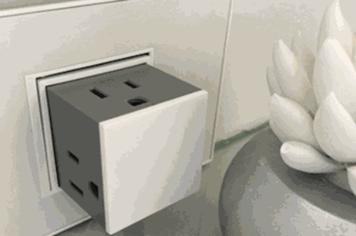 This Sleek Pop Up Outlet Lets You Plug In Three Cords At Once This Sleek Pop Up Outlet Lets You Plug In Three Cords At Once