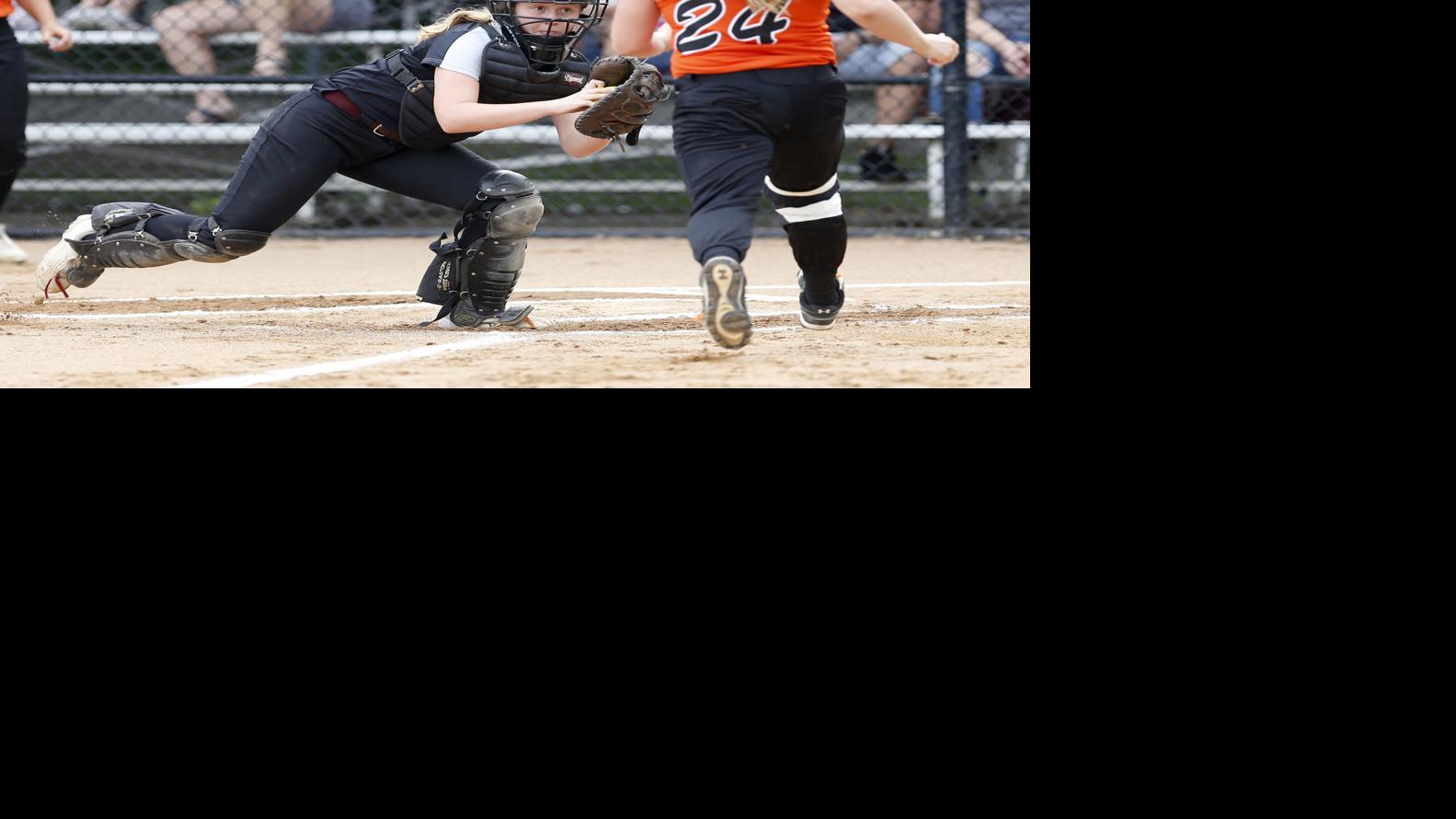 Metro softball East, West swap wins Softball