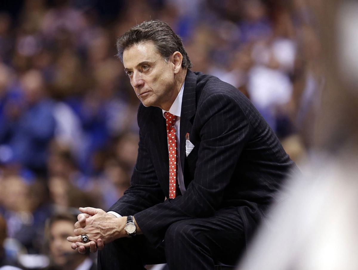 Former Louisville head coach Rick Pitino late in the second half of a 74-69 loss to Kentucky in the NCAA Tournament's Midwest Region semifinal at Lucas Oil Stadium in Indianapolis on March 28, 2014.