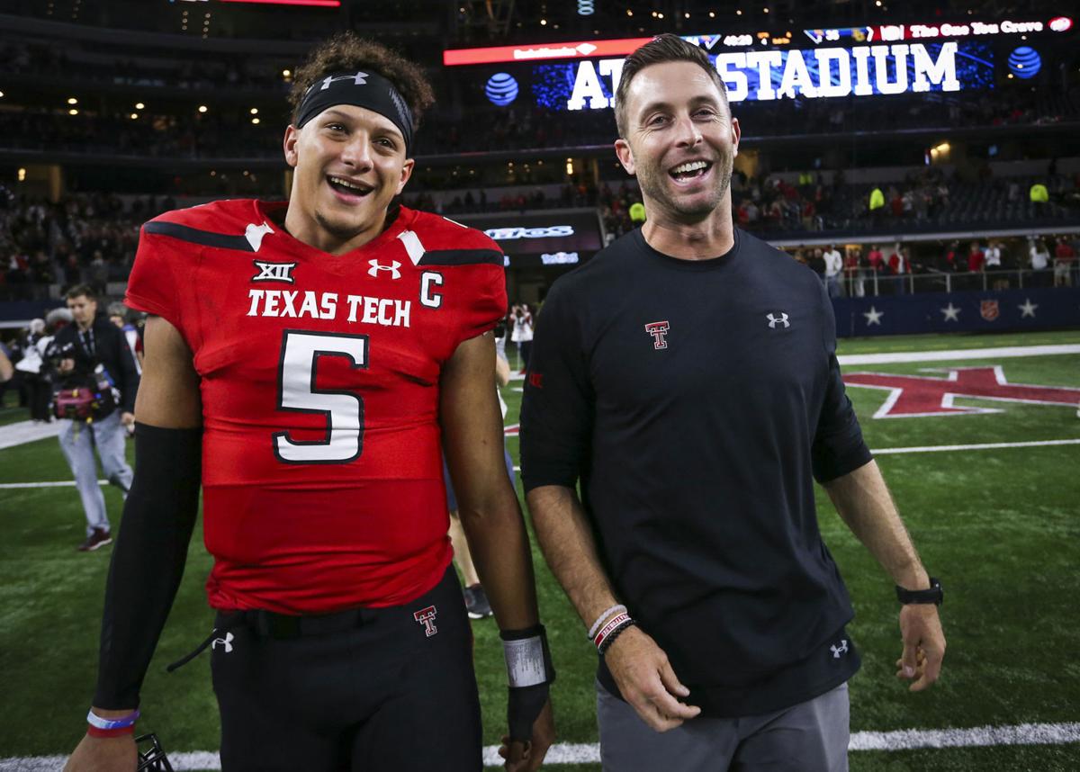 Texas Tech quarterback Patrick Mahomes II (5) and head coach Kliff Kingsbury walk off the field after after a 54-35 win against Baylor at AT&T Stadium in Arlington, Texas, on Nov. 25, 2016.