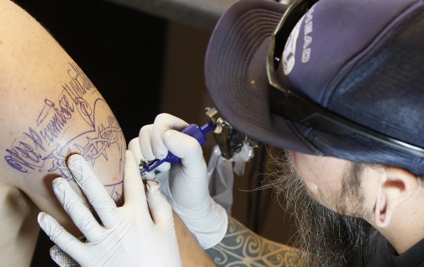 Making their mark Tattooists say their art is going mainstream