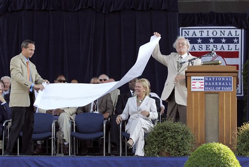 Roberto Alomar holds his plaque after his induction into the Baseball Hall  of Fame in Cooperstown, N.Y., on Sunday, July 24, 2011. (AP Photo/Mike  Groll)