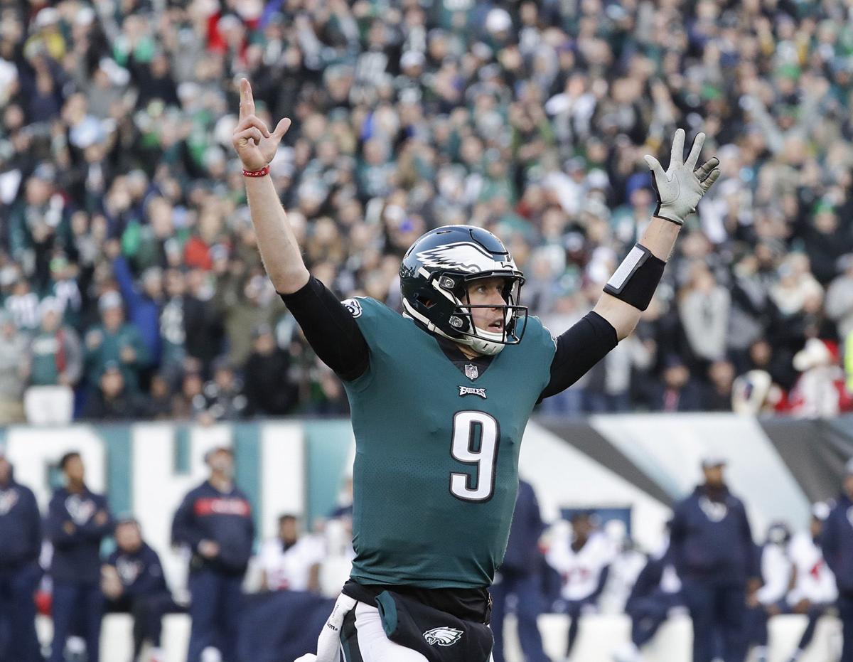 Philadelphia Eagles quarterback Nick Foles raises his arms after throwing a fourth-quarter touchdown to teammate tight end Zach Ertz against the Houston Texans on Sunday, Dec. 23, 2018 at Lincoln Financial Field in Philadelphia, Pennsylvania.