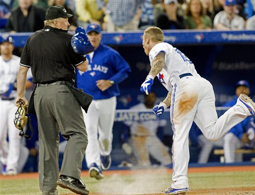 Toronto Blue Jays' Brett Lawrie keeps an eye on his hands