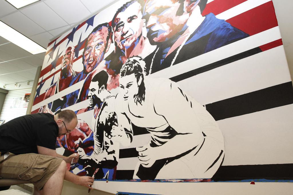 Premiere Wwe Portrait Artist Paints Large Mural At Dan Gable