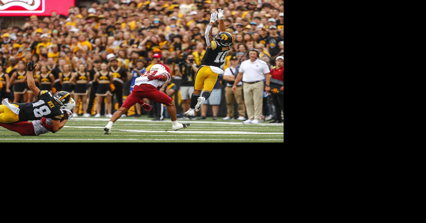 Three current, former Iowa college football players, one staffer charged