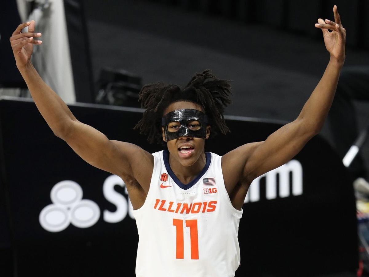 Illinois guard Ayo Dosunmu reacts after scoring a layup and taking a foul from a Rutgers player in the first half of a quarterfinal in the Big Ten Tournament on Friday at Lucas Oil Stadium in Indianapolis.