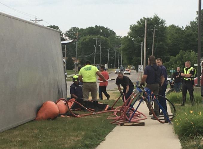 Semi hauling hogs overturns in Waterloo