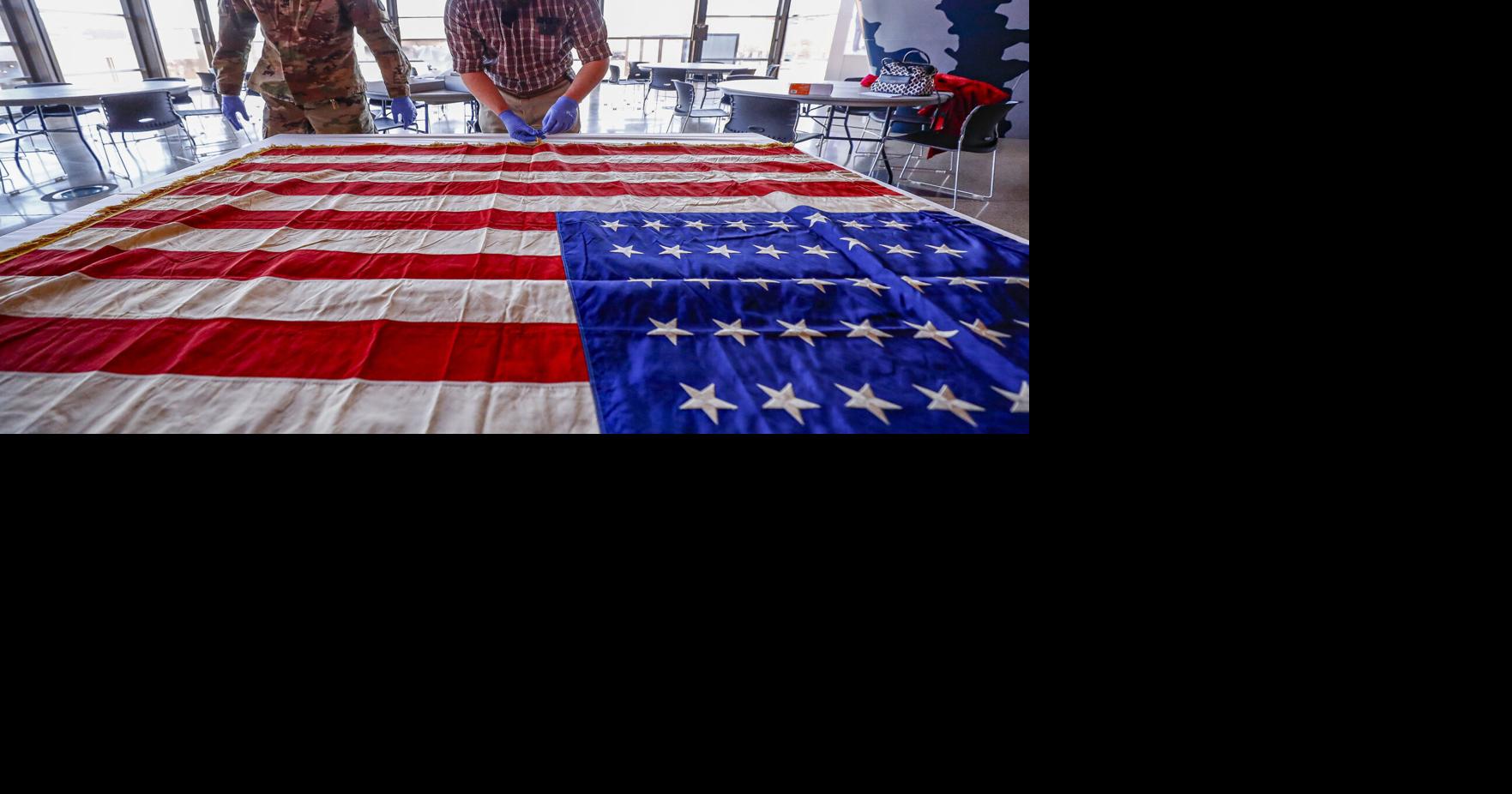 American flag carried in WWII by Waterloo troops returns to Grout Museum