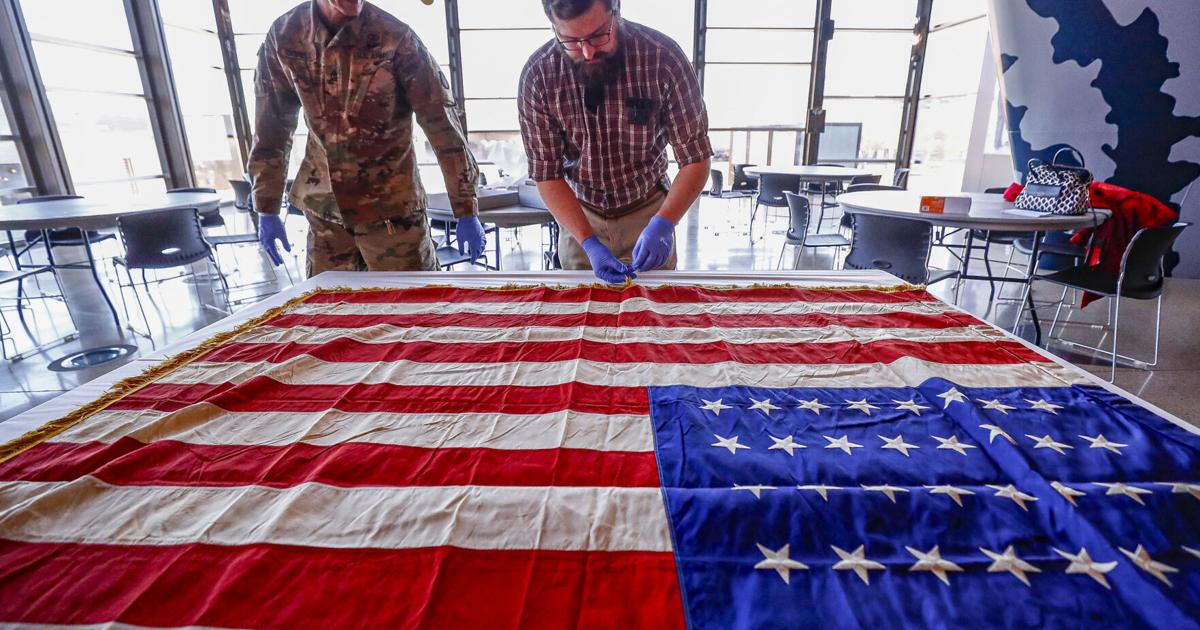 American flag carried in WWII by Waterloo troops returns to Grout Museum
