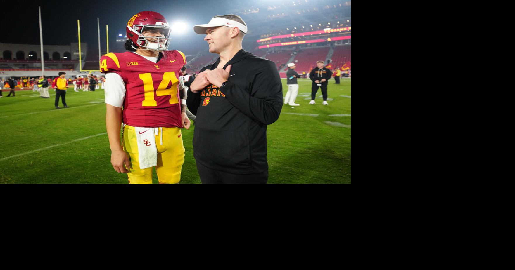 Southern California Trojans quarterback Jayden Maiava (14) and head coach Lincoln Riley react after the game against the UCLA Bruins at United Airlines Field at Los Angeles Memorial Coliseum.
