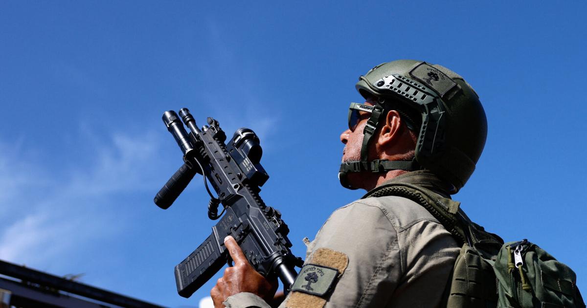 Israeli civilian response team searches for a hostile drone in Metula