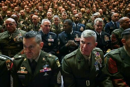 Military members look on before US President Donald Trump addresses senior military officers gathered at Marine Corps Base Quantico in Quantico, Virginia, on September 30, 2025