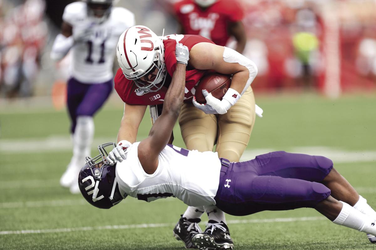 Taylor Defense Lead No 8 Badgers Past Northwestern 24 15