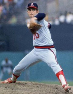 Jim Abbott of the California Angels meets on the mound with his