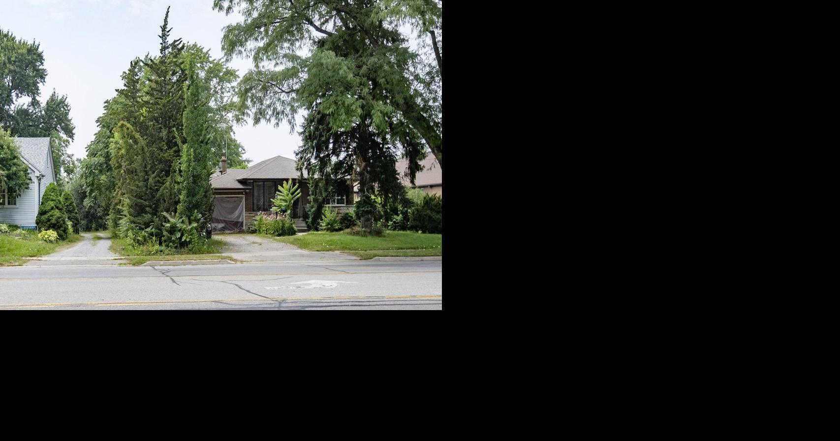 Plan for 50-unit apartment in St. Catharines where two houses stand opposed by neighbours