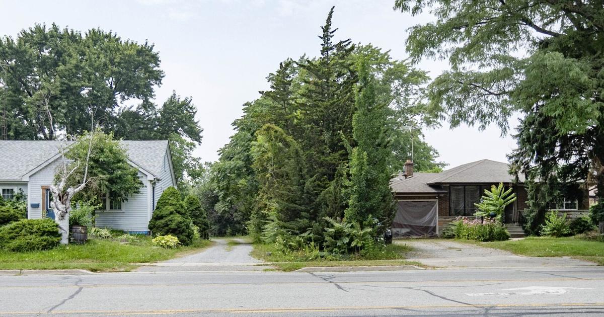 Plan for 50-unit apartment in St. Catharines where two houses stand opposed by neighbours