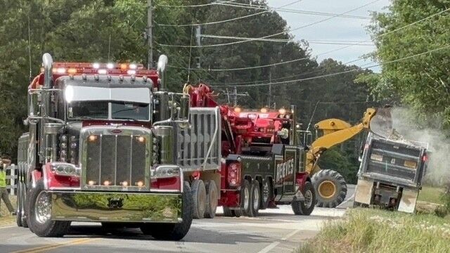 Pine Log Road reopens after crews clear overturned dump truck spill ...