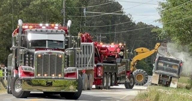 Pine Log Road reopens after crews clear overturned dump truck spill ...