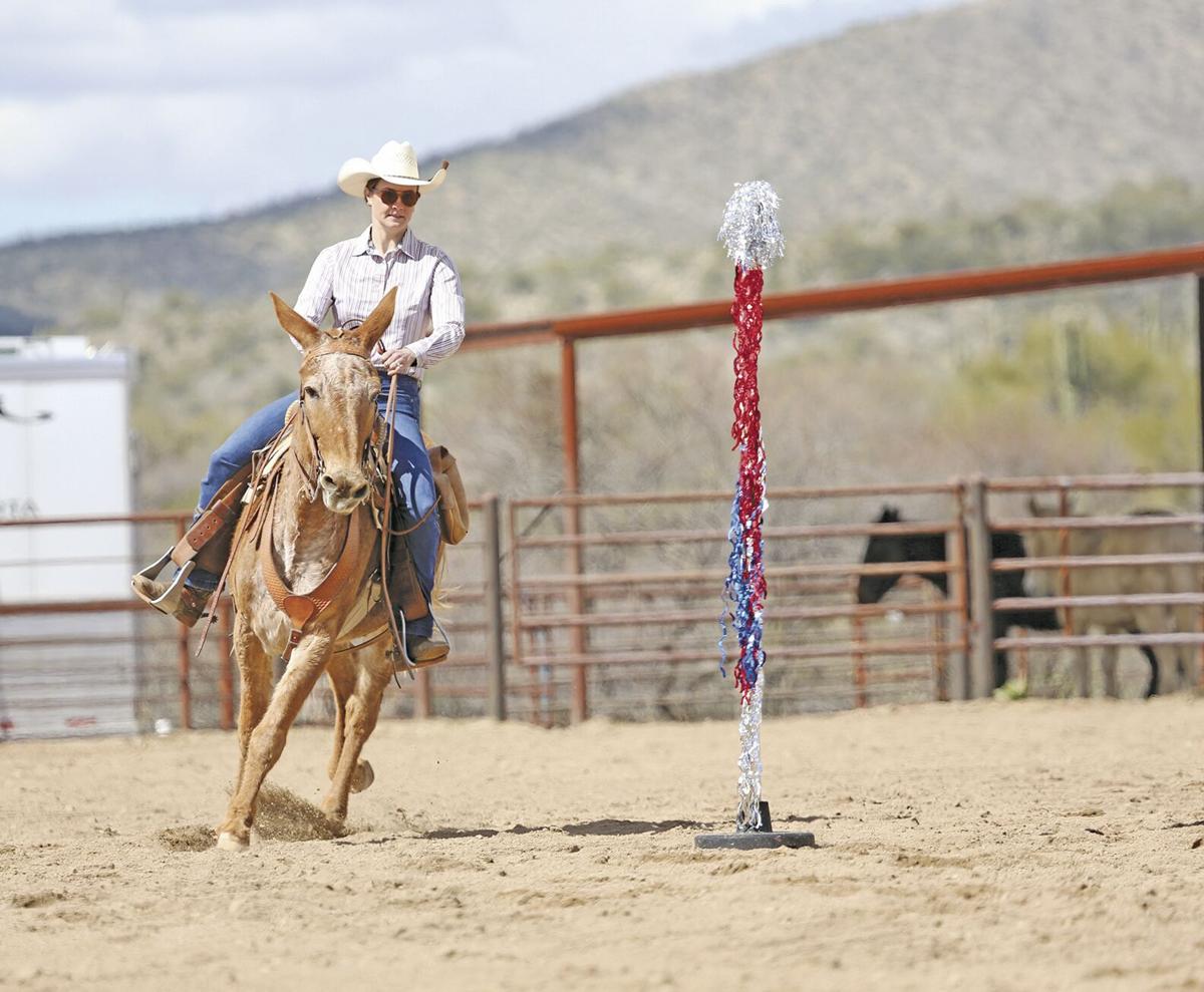 Justine Watt participates in the Mule Ramble Roping & Riding