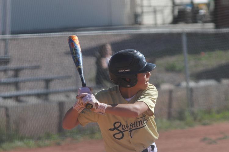 Little League Juniors baseball teams battle at the plate