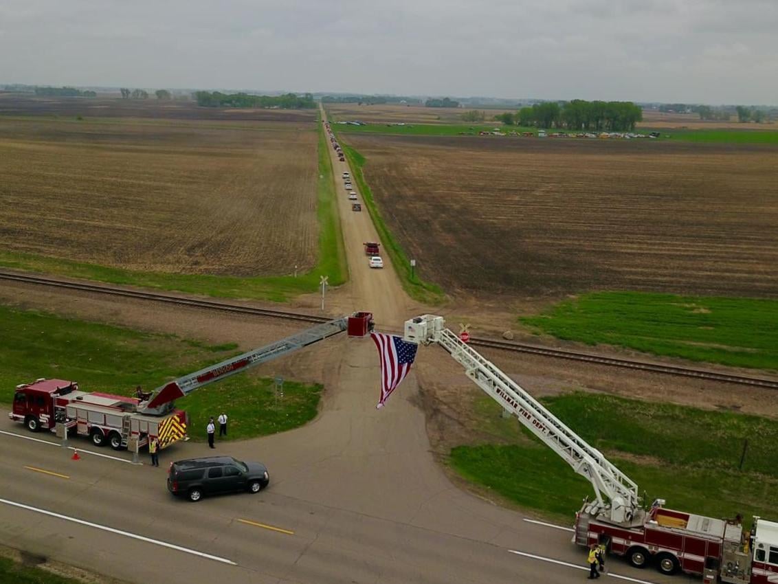 Firefighters honor one of their own killed in a crash near Kerkhoven