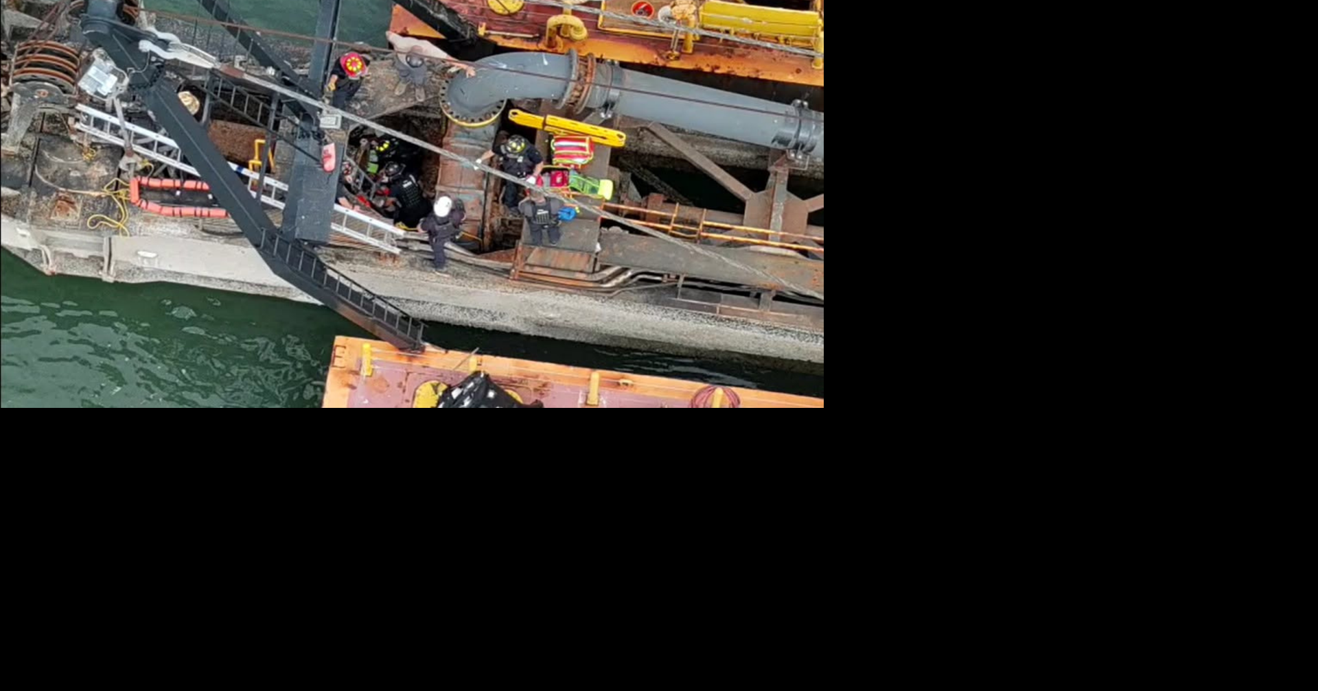 Firefighters extract man who fell while working on barge