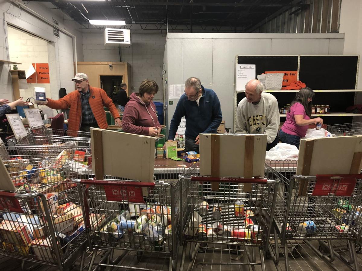 Volunteers help sort through 10 Days of Giving donations at Winona ...
