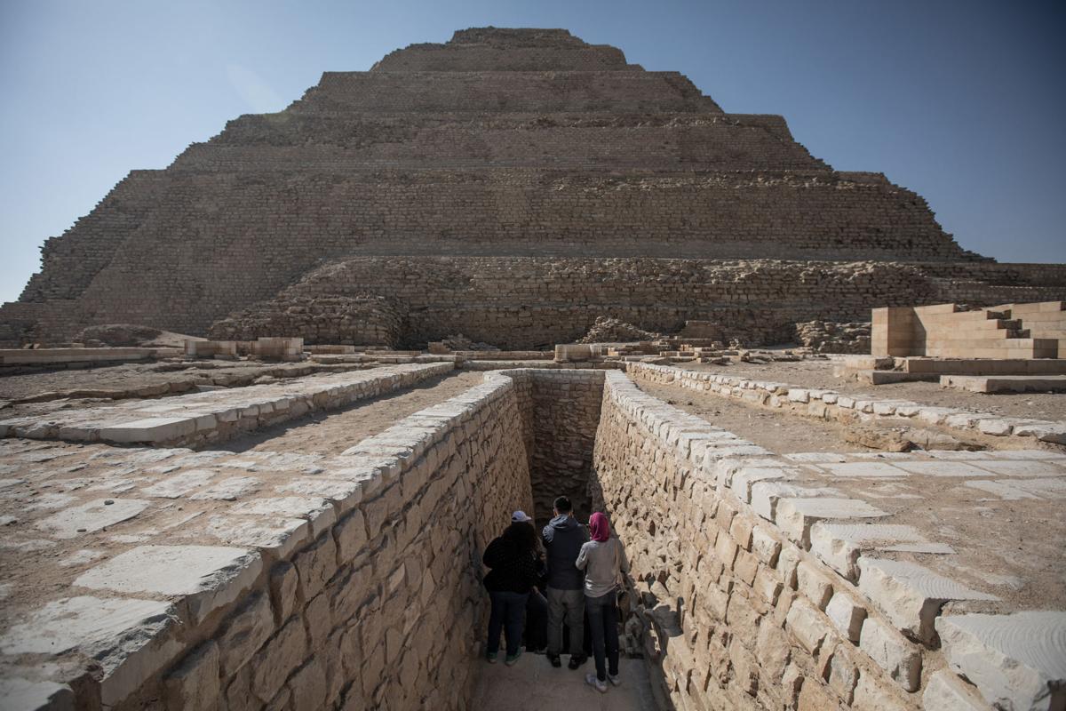 People enter the Pyramid of Djoser in Saqqara outside Cairo on March 5, 2020. Also know as the Step Pyramid, the believed world's earliest stone structure reopened again for tourists after almost 20 years of renovations. The Pyramid of Djoser was built during the Third Dynasty in 27th century BC for the burial of Pharaoh Djoser.