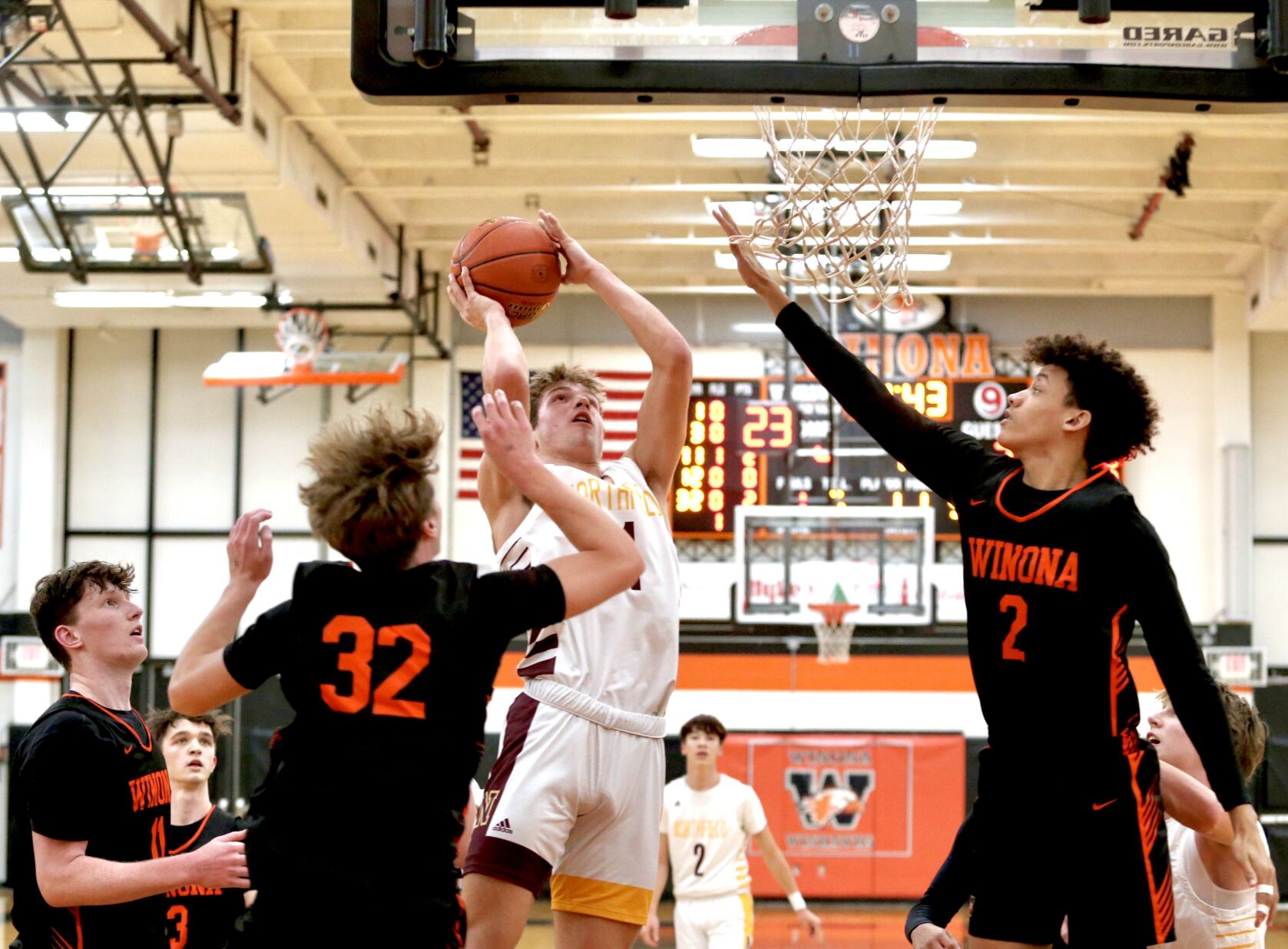 High School Sports Roundup: Winona Basketball Suffers Grueling Home Defeat, Cotter Bounces Back, and Winona Hockey Continues Winning Streak